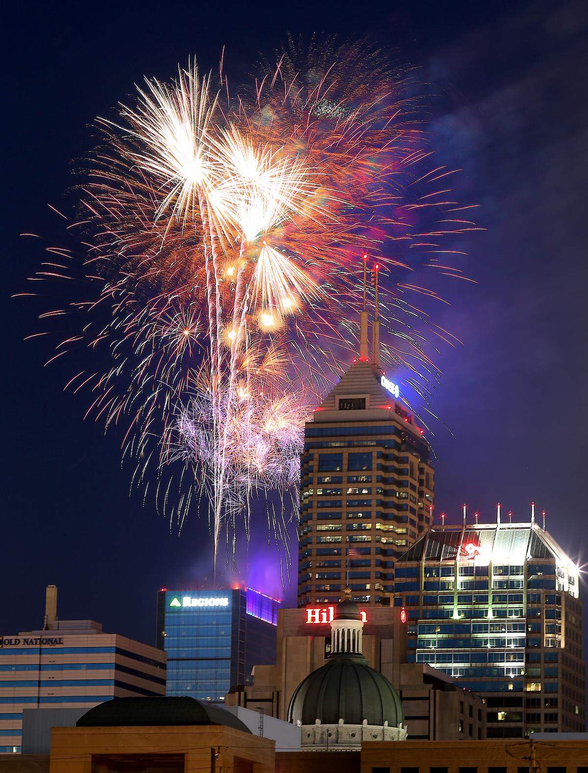 Fireworks are set off from atop the Regions tower in downtown Indianapolis on July 4, 2014.