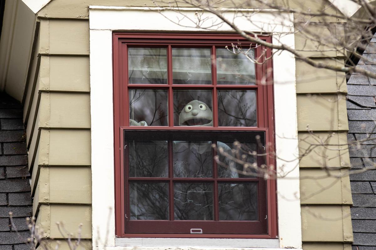 A plush toy sat in a second-story window on Chenault Road.