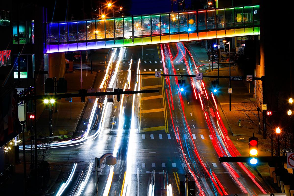 The pedestrian walkway over Broadway between the Hyatt Regency and the Central Bank Building is illuminated with color changing LED lighting in Lexington, Ky., Wednesday, Jan. 22, 2020. Both pedestrian walkways over Broadway will be illuminated nightly as part of the LexLights! Initiative.