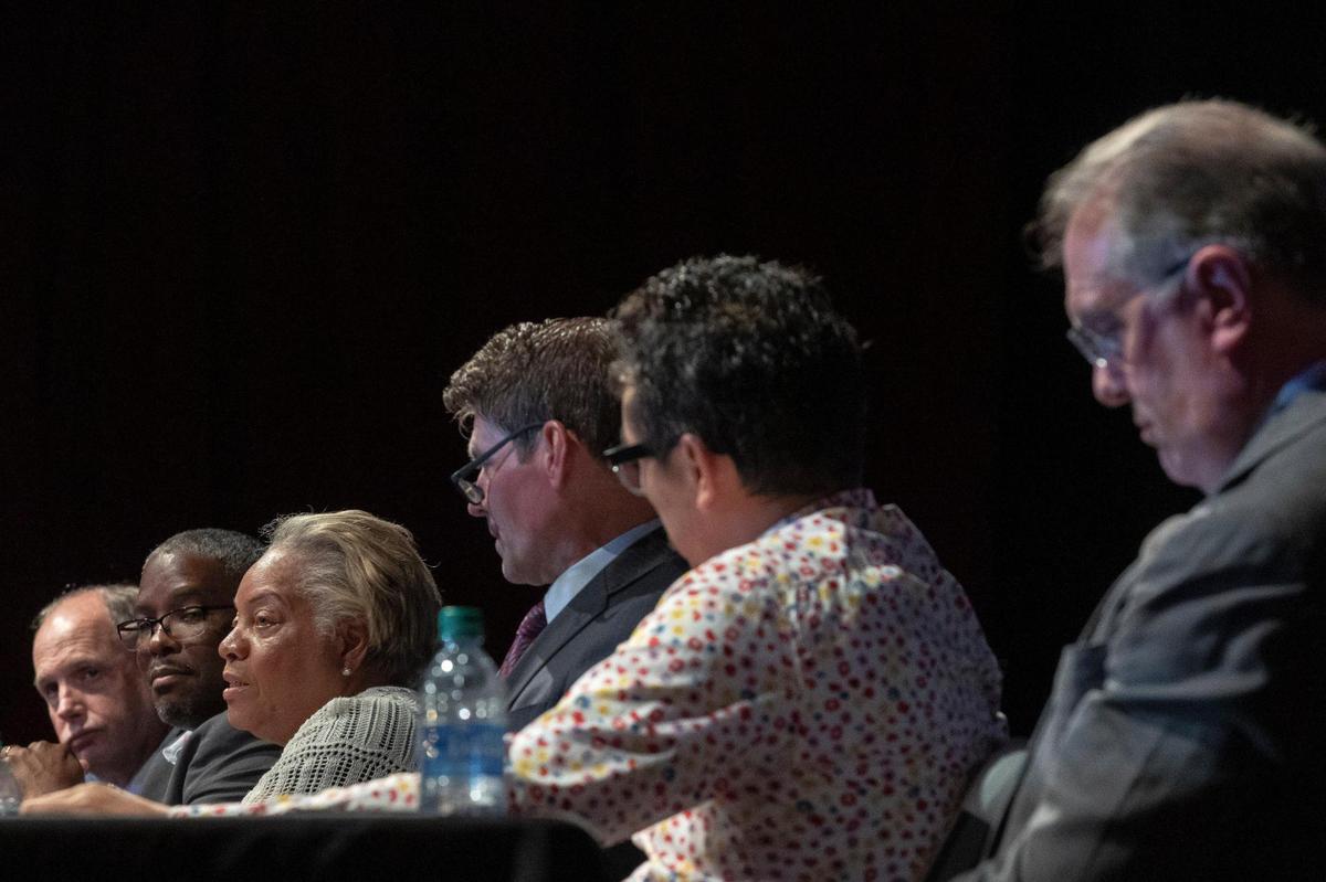 Richard Moloney, from left, James Brown, Lillie Miller-Johnson, Chuck Ellinger, Dan Wu and Bill Farmer Jr., candidates for councilor-at-large, attend a candidate forum at the Lyric Theatre and Cultural Arts Center in Lexington, Ky., on Wednesday, Sept. 14, 2022.