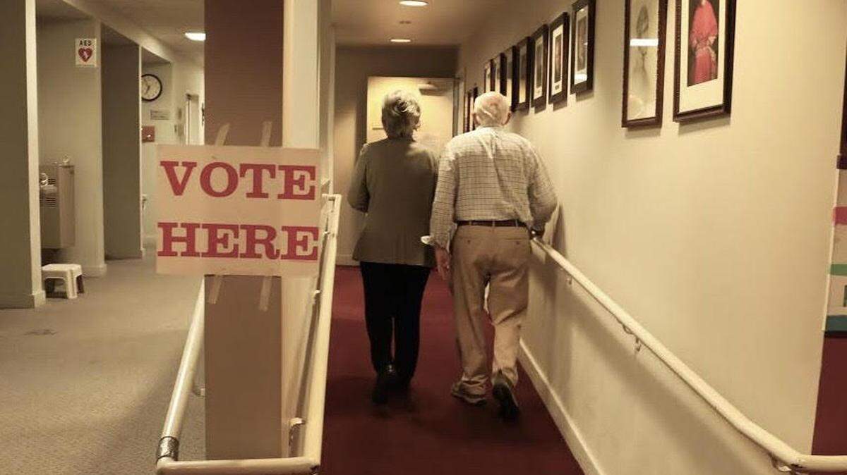 Annie Rooney French and Nelson French walk to the voting room inside the Newman Center in Lexington, Kentucky on Tuesday, May 21st, 2019.