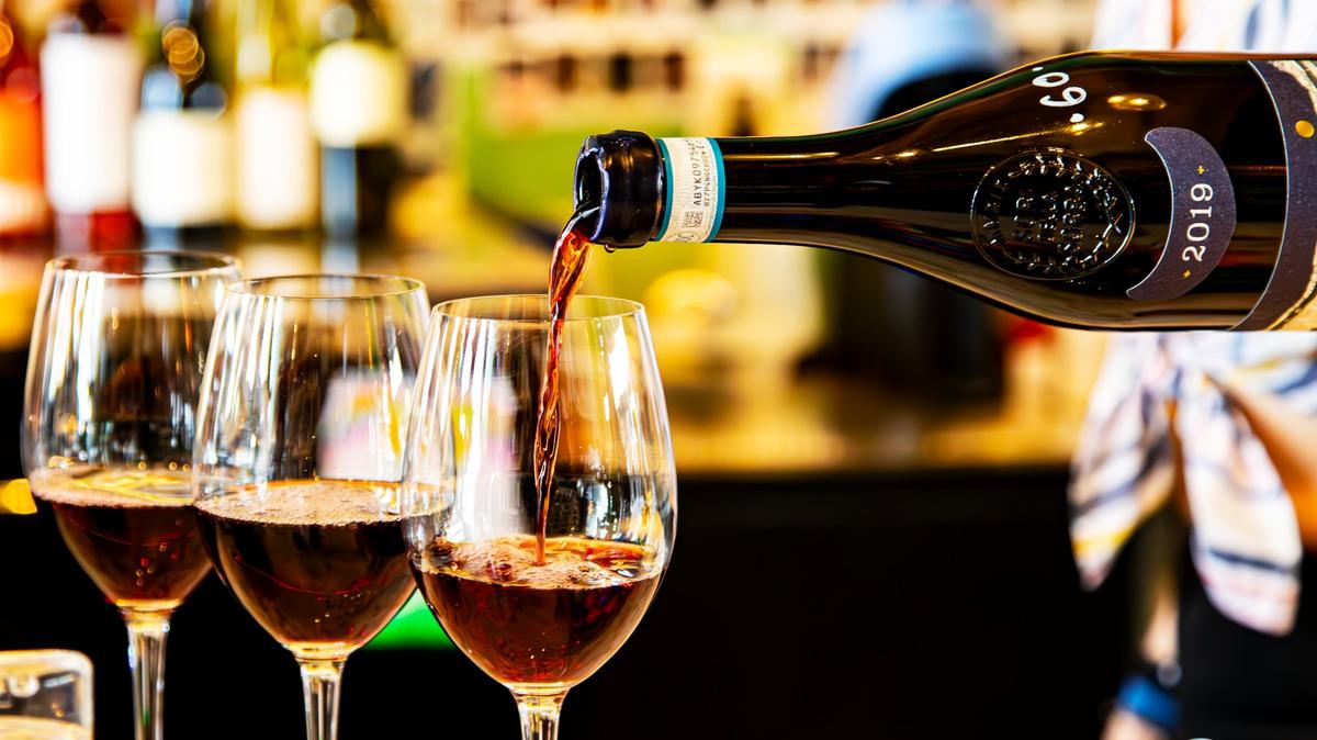 A robust 2019 red wine pours freely at Darling Wine Bar in Greyline Station, located in suit 164 on March 20, 2025, in Lexington, Ky. Darling has more than 50 wines and regularly stocks bottles from the nearby University of Kentucky Winery.