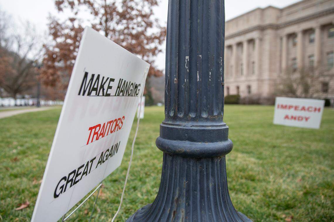 Signs calling for the impeachment of Kentucky Gov. Andy Beshear were placed on the lawn of the state Capitol in Frankfort, Ky., on Tuesday, Jan. 5, 2020.