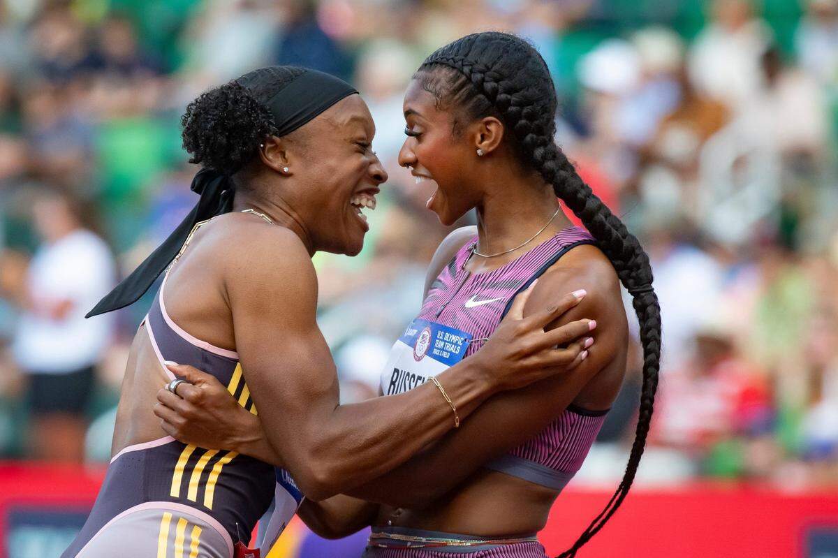 Masai Russell, right, celebrates winning the women's 100 meter hurdles with third place finisher Grace Stark during the final day of the U.S. Olympic Track & Field Trials Sunday, June 30, 2024, at Hayward Field in Eugene, Ore.