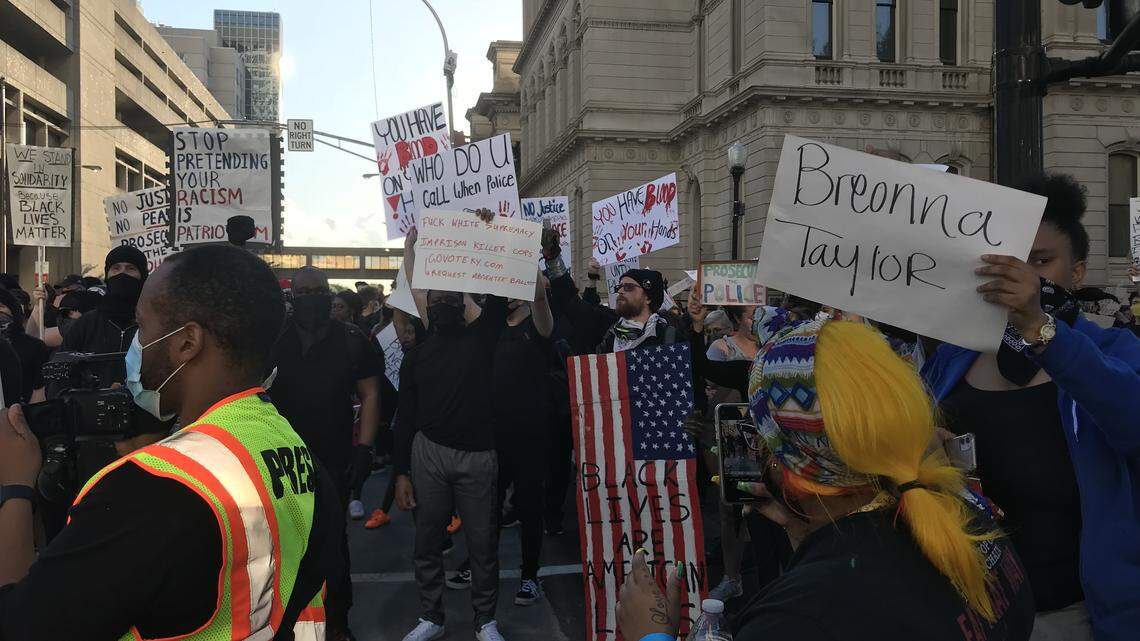 Protesters gathered in downtown Louisville Friday night to call for answers in the death of 26-year-old Breonna Taylor, who was shot and killed by police in March.