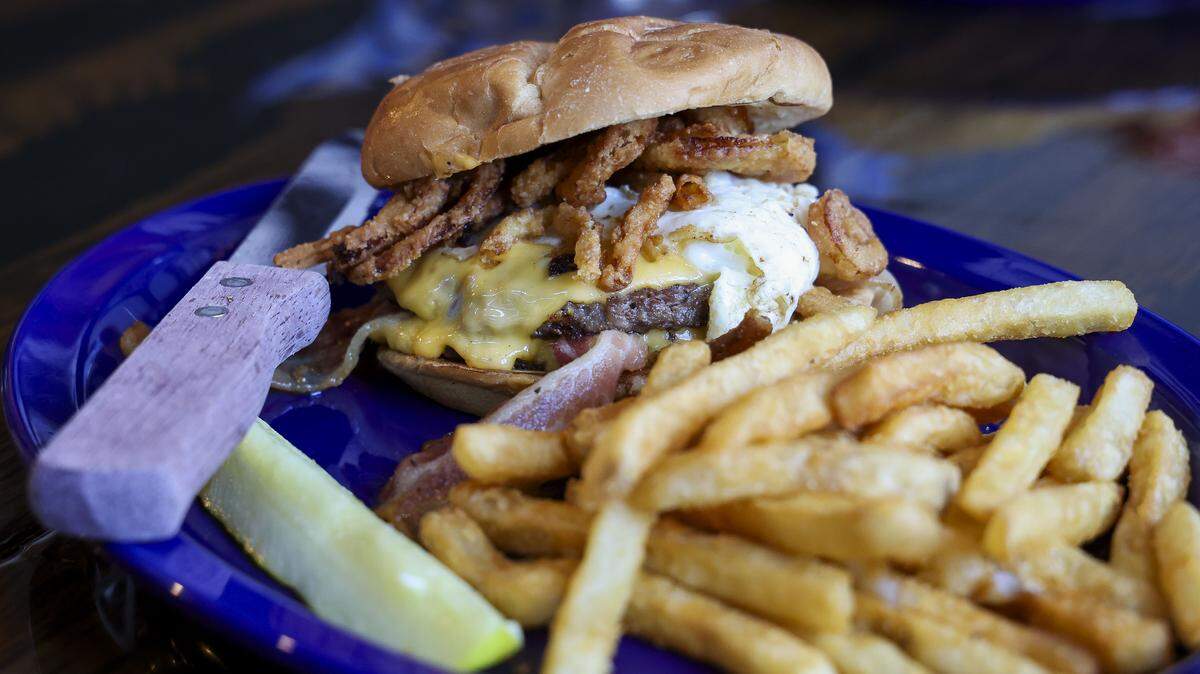 The Midnight Madness smash burger ($13.50) with American cheese, egg, bacon and crispy onion tanglers from KSBar & Grille. The sports bar is getting its Kentucky Proud beef delivered from Noche Linda Farms in Paris.
