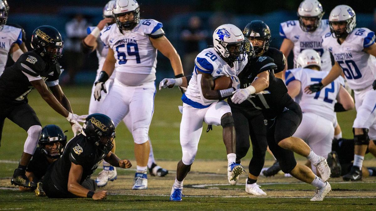 Lexington Christian’s Xavier Brown (20) runs with the ball against the Boyle County Rebels earlier this season. He rushed for 177 yards and four TDs Friday against Owensboro Catholic.