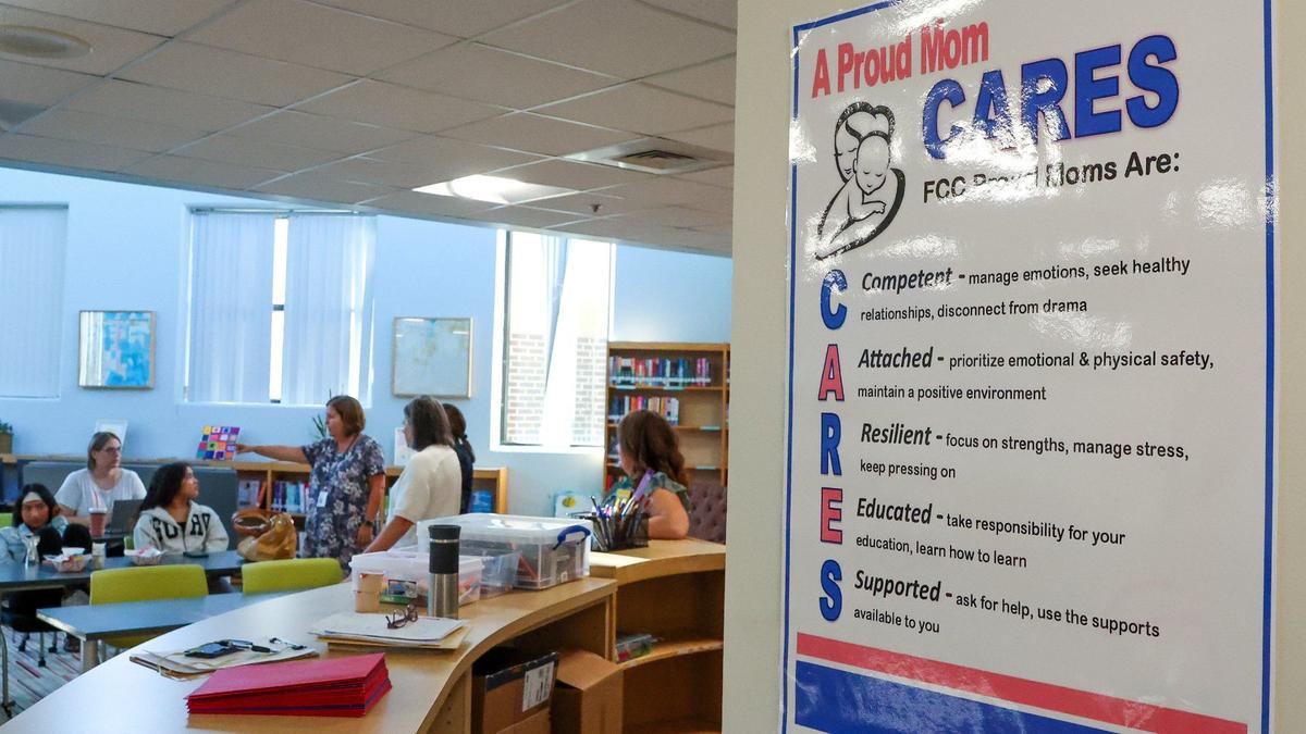 Teen mothers and expected mothers meet in the library on the first day of school for Fayette County Public Schools, Wednesday, Aug. 14, 2024, at the Family Care Center in Lexington, Ky. Last year15 moms graduated from the high school.