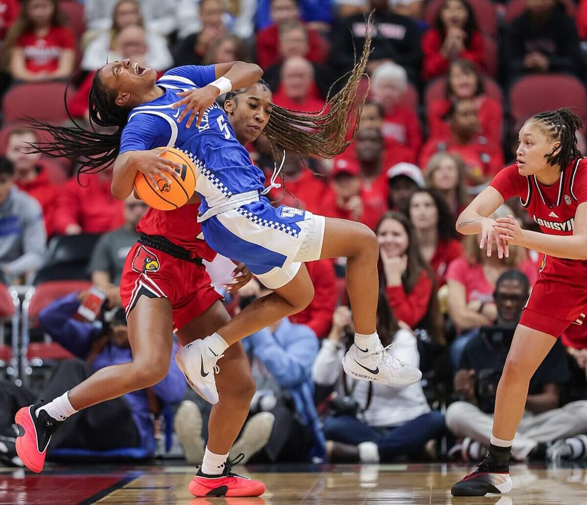 Kentucky point guard Tonie Morgan (5) scored 19 points, grabbed five rebounds and doled out seven assists in the Wildcats’ 72-62 win at intrastate rival Louisville last Saturday. Next up for Morgan and the No. 16 Wildcats is a matchup vs. No. 7 Maryland in the Discover Puerto Rico Tournament.