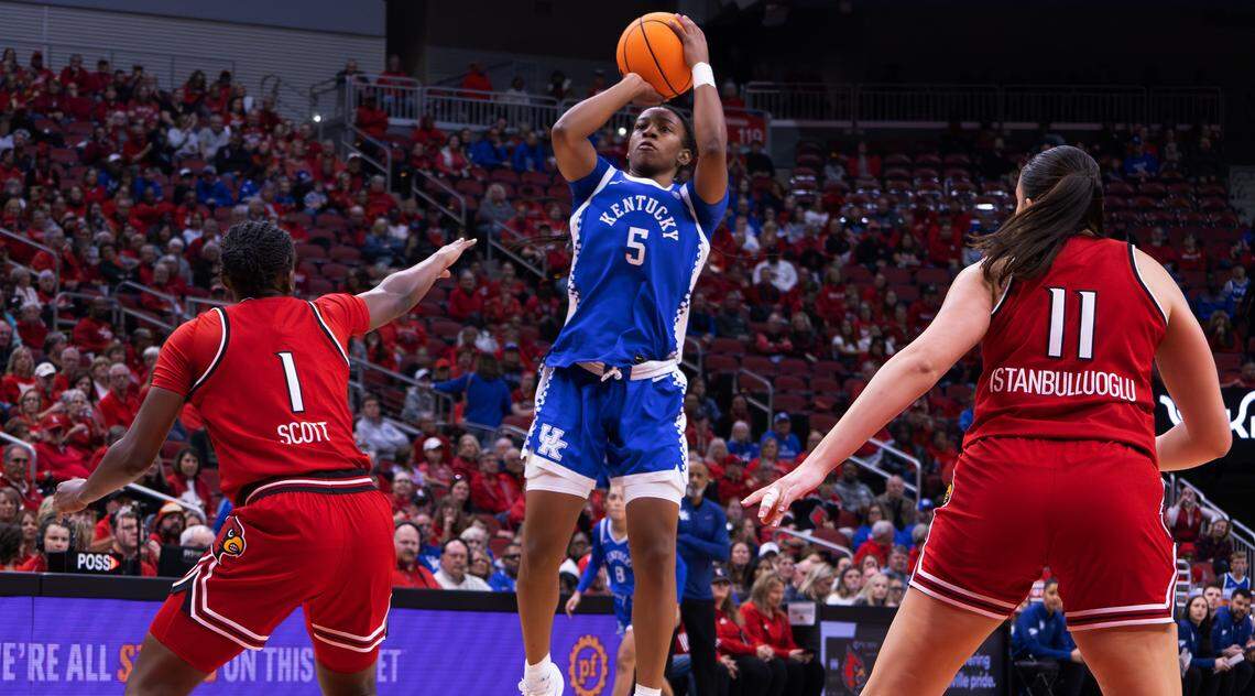 Kentucky's Tonie Morgan (5) takes a shot against Louisville on Saturday. She scored 19 points.