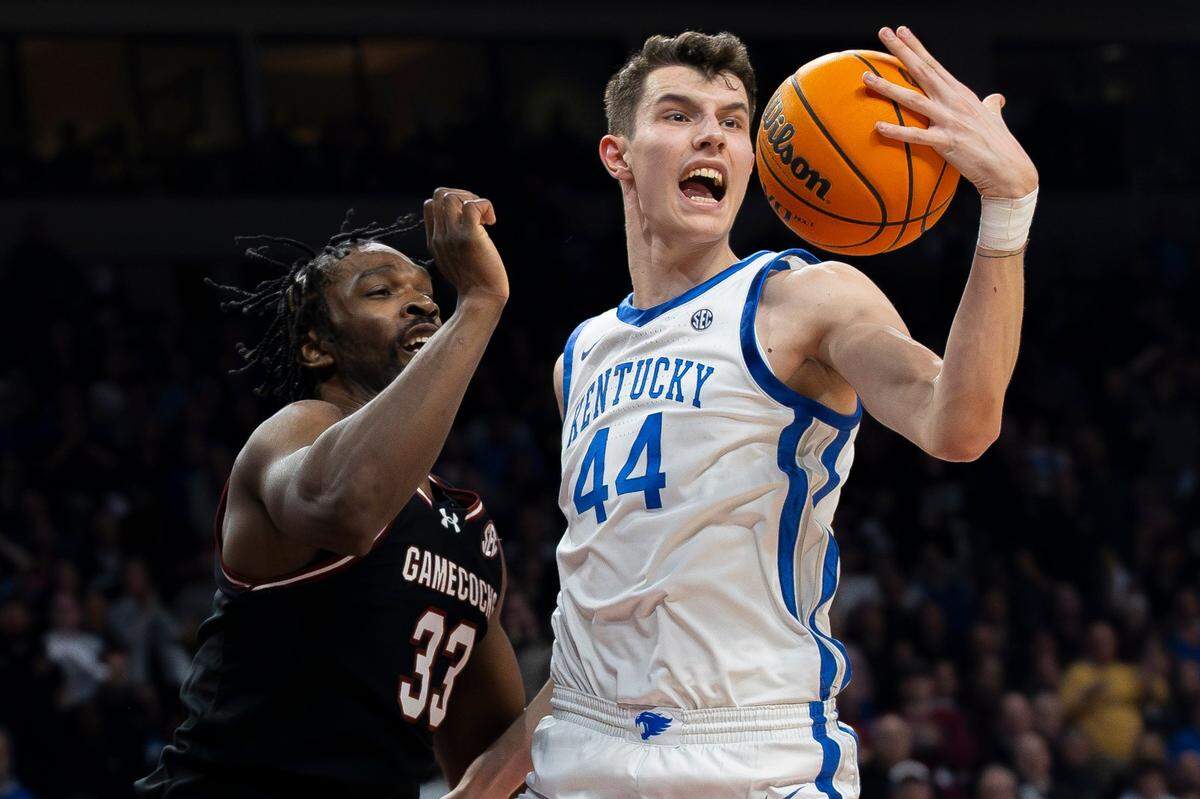 Kentucky forward Zvonimir Ivisic (44) grabs a rebound in front of South Carolina forward Josh Gray (33) on Tuesday night.