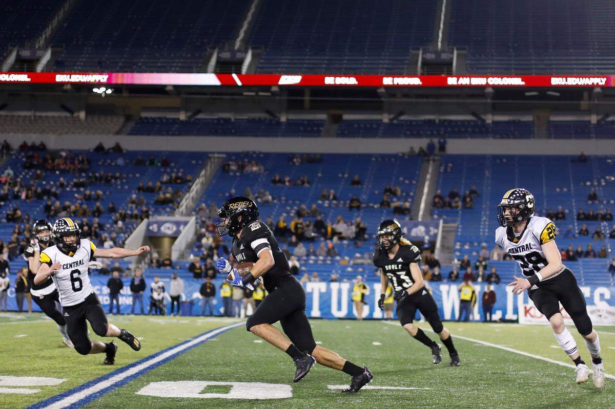 Boyle County’s Cole Lanter (6) runs the ball between Johnson Central’s Cole Campbell (6) and Reece Goss during the Class 4A state finals at Kroger Field on Dec. 3. The Rebels won 30-13.