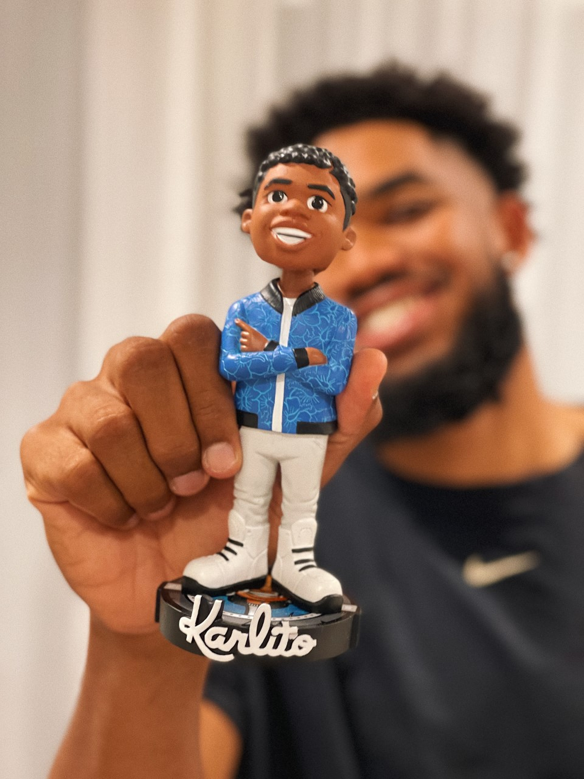 Former Kentucky star Karl-Anthony Towns posed with his new “Karlito” bobblehead.
