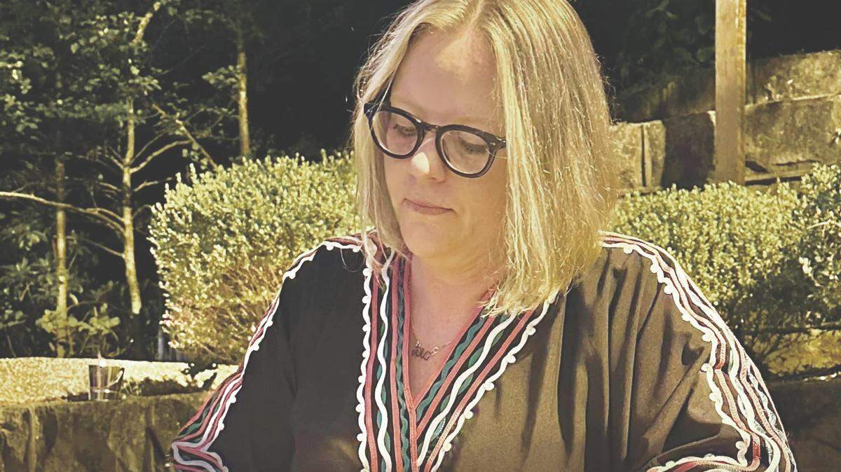 Mandi Fugate Sheffel signs copies of her memoir, “The Nature of Pain,” at her launch party in Hazard on Saturday, Oct. 4.