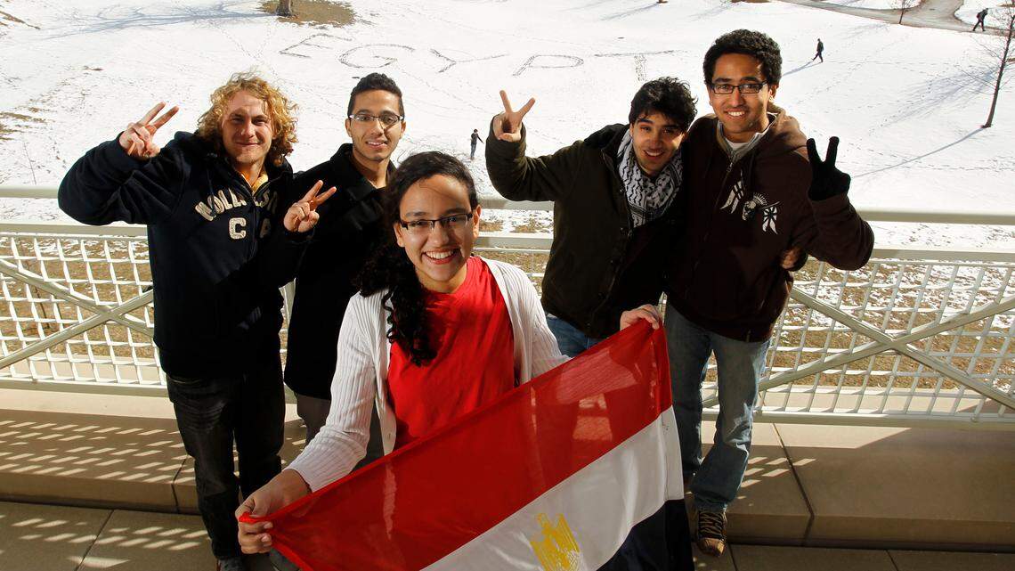 University of Kentucky students from left, Cody Griggs, Shady El-Maraghi, Hadil Abdalla, Mohamed Bakr and Mahmoud Abdalla celebrated Friday's news outside the William T. Young Library.  