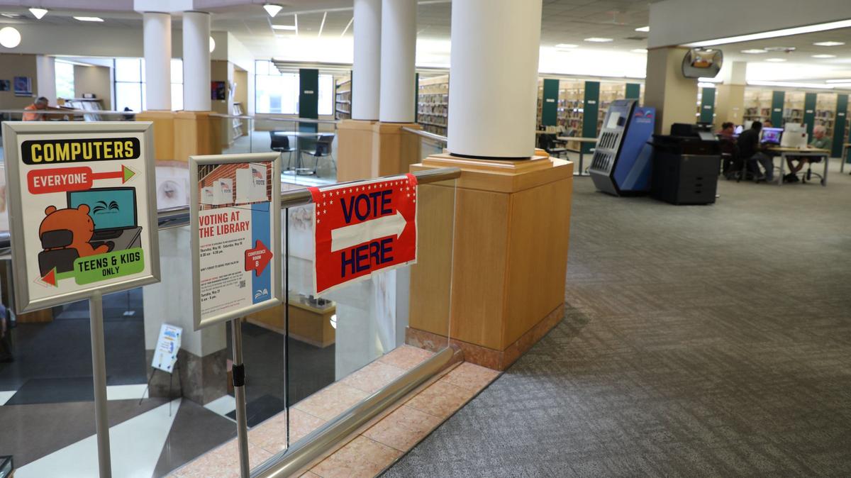 A “vote here” sign directs voters to the polls located in the main conference room on the second floor of the Central Library, downtown Lexington, Ky., May 21, 2024. Here’s what you can expect on your General Election ballot Tuesday, Nov. 5.