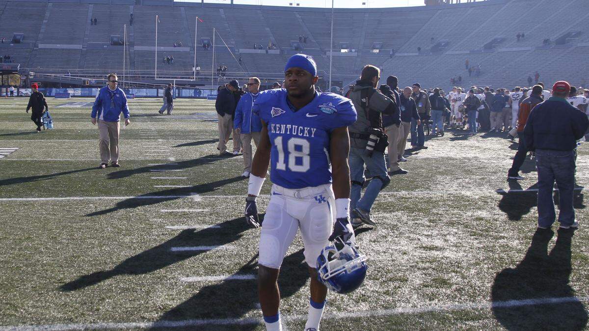 Randall Cobb walked off the field — perhaps for the final time as a Wildcat — after Kentucky's loss to Pittsburgh in Birmingham, Ala. Go to KentuckySports.com for more photos from Saturday's game.        