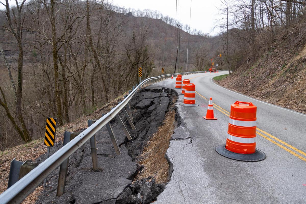 A washed out section of road is blocked by cones outside Inez in Martin County, Ky., Wednesday, March 17, 2021. In early March heavy rains and flooding caused damage to water lines leaving many customers without water. In spite of Alliance Water Resources work to repair the water systems, lines and the water treatment plant there are still concerns regarding the affordability and the safety of the water in Martin County from the Martin County Concerned Citizens.