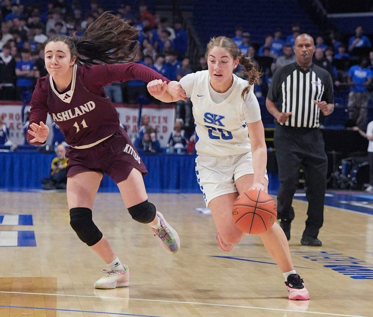 Simon Kenton guard Bella Ober dribbles past Ashland Blazer’s Gabby Karle during the Clark’s Pump-N-Shop Girls’ Basketball Sweet 16 first round at Rupp Arena on Thursday.