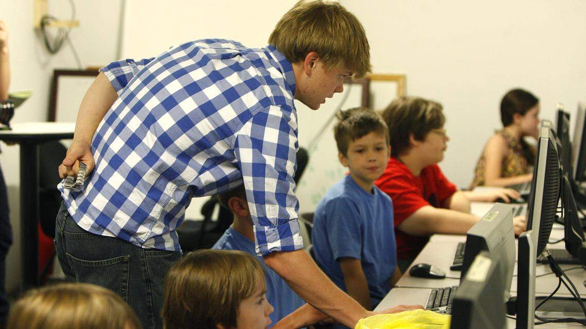 UK sophomore Robert McGillivray worked with students on Minecraft Mod using Java coding during a summer camp at Newton's Attic on Thursday.  