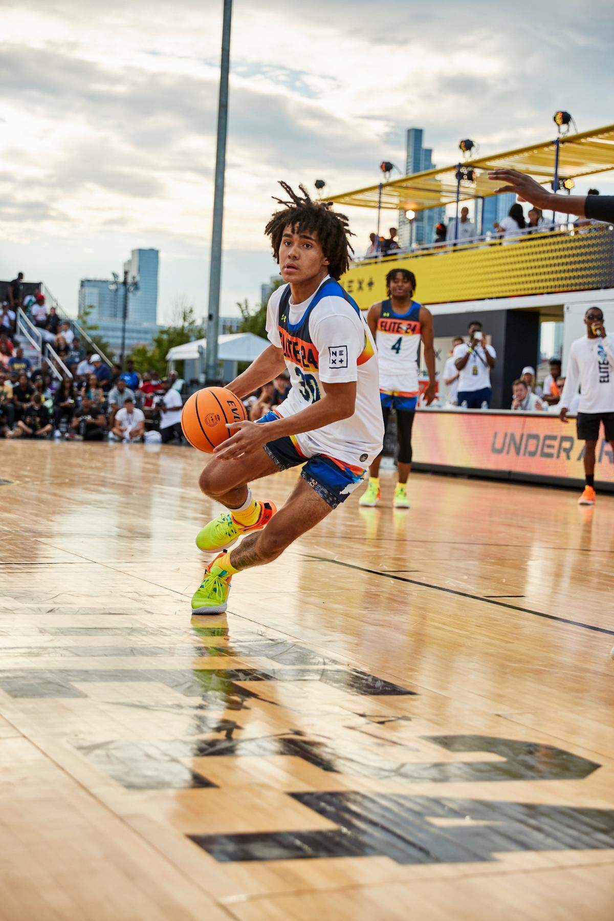 Class of 2024 Kentucky men’s basketball recruit Elliot Cadeau drives to the rim during the Under Armour Next Elite 24 event in August in Chicago.