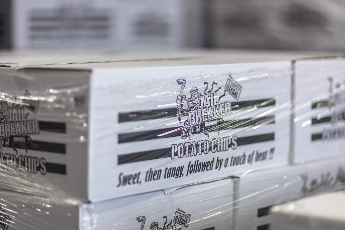 Cases of Jail Breaker Brands potato chips wait to be distributed from a warehouse at the company’s headquarters in London, Ky. 