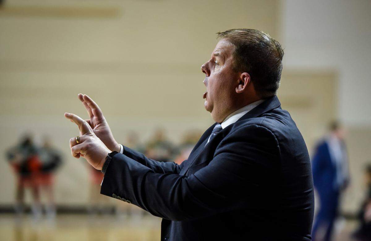 Lexington Catholic head coach Brandon Salsman gave his team instructions against Frederick Douglass on Thursday night.