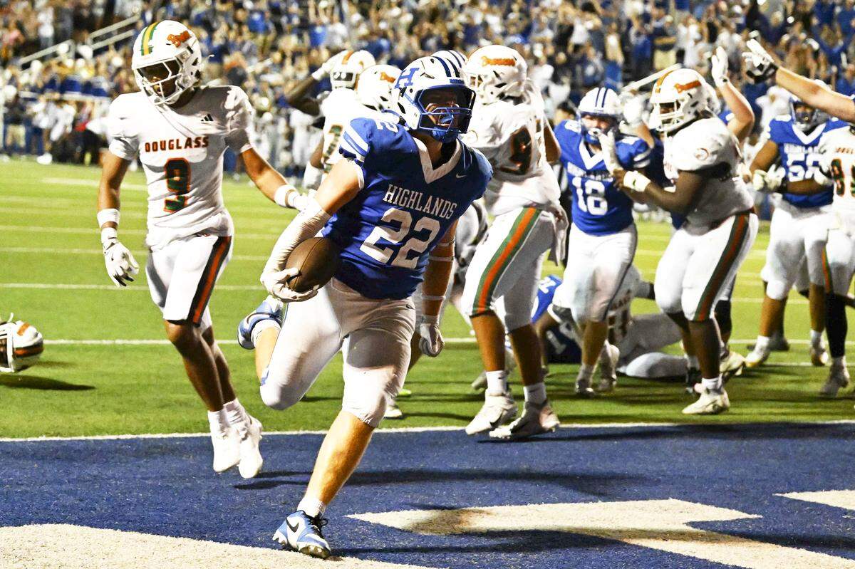 Highlands tight end Tayden Lorenzen celebrates scoring the game-winning 2-point conversion in the Bluebirds’ 21-20 victory against visiting Frederick Douglass on Friday.