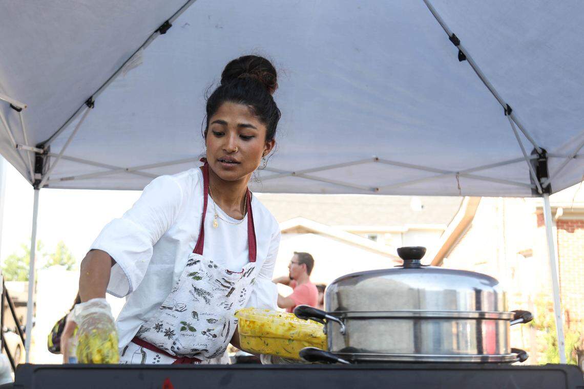 Babita Shrestha prepares to fry pakora, a seasoned vegetable fritter native to Nepal and India.