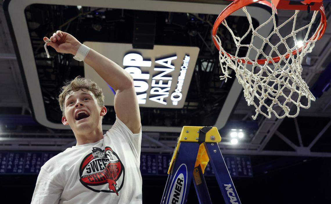 Aden Slone displays a piece of the net after George Rogers Clark won the Boys’ Sweet Sixteen in Rupp Arena last season. The Cardinals were to begin their title defense this week in the 40th District Tournament at Bourbon County.