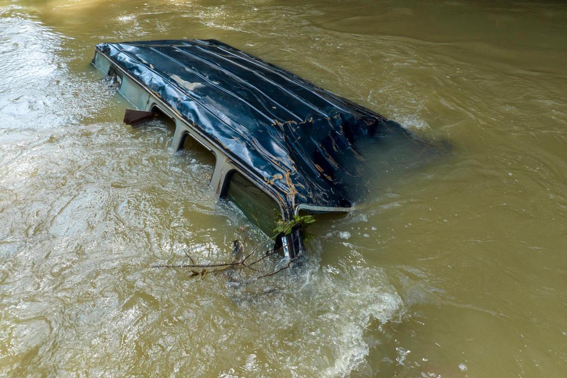 A vehicle is submerged in Troublesome Creek near Dwarf, Ky., on Tuesday, Aug. 2, 2022. Flood waters devastated many communities in Eastern Kentucky in late July.