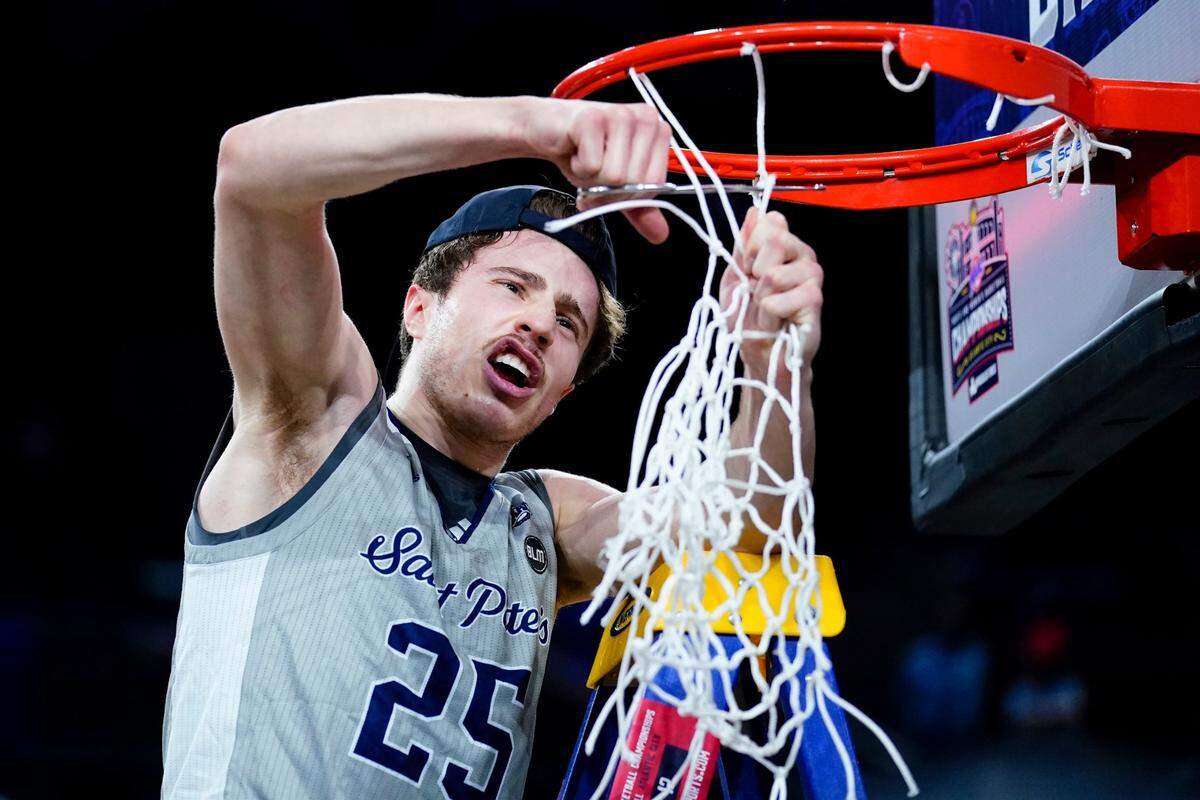 Saint Peter’s Doug Edert celebrates after scoring 20 points to help the Peacocks defeat Monmouth 60-54 in the championship of the Metro Atlantic Athletic Conference Tournament.