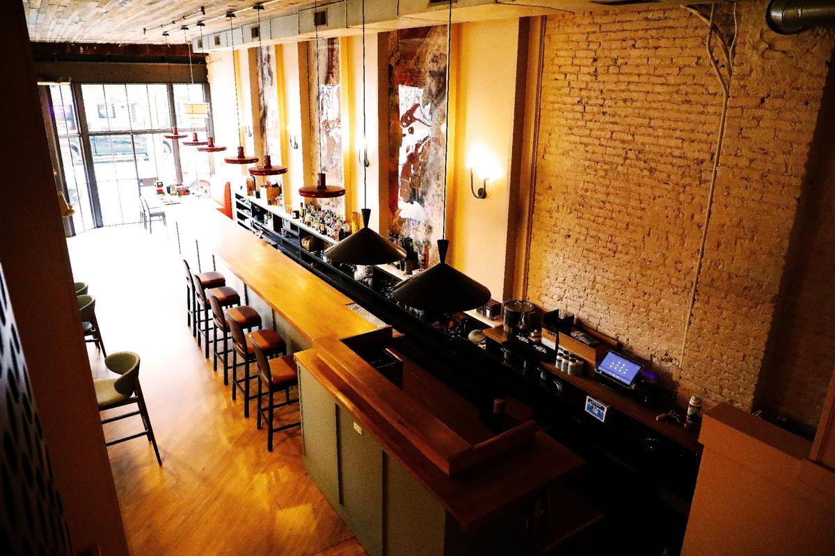 The bar the new Lexington restaurant 3TEN has been updated with warm lighting. Seating will be available for walk-ins at the bar.