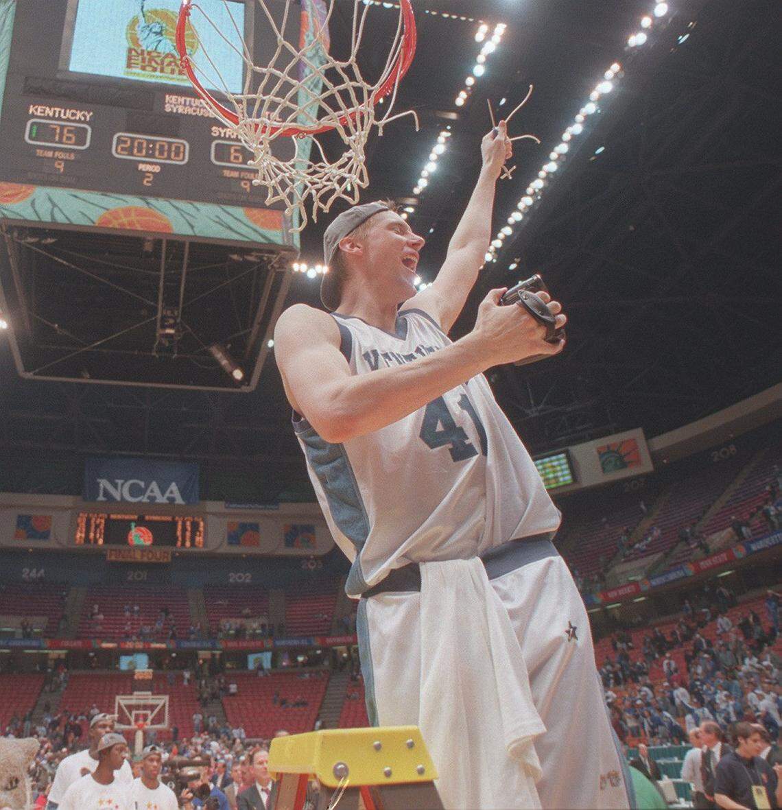 Mark Pope cut down the net after helping Kentucky win the 1996 national championship.