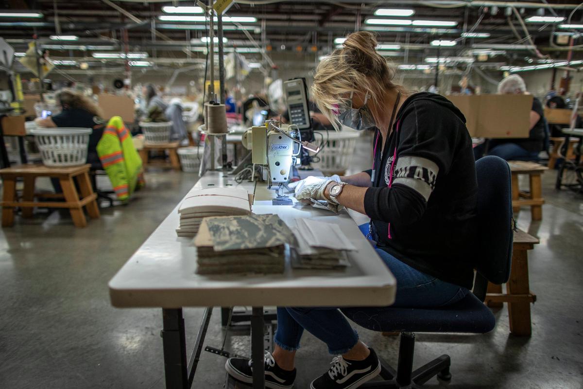 Frankie Patterson sews face masks at Southeast Kentucky Rehabilitation Industries in Corbin, Ky., on Monday, March 30, 2020. The non-profit corporation, which makes sewn products for the U.S. military, has begun producing protective masks for the Kentucky state government.