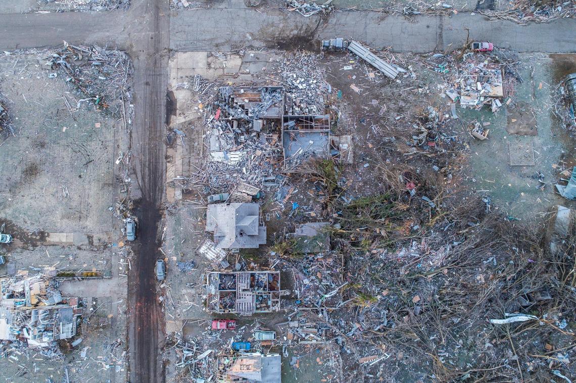 An aerial picture of structures in downtown Mayfield, Ky., taken on Sunday, Dec. 12, 2021, after a tornado cme through town. Gov. Andy Beshear said Sunday the number of people killed by a deadly series of tornadoes that tore through Western Kentucky Friday and Saturday is now above 80 and will likely climb to 100.