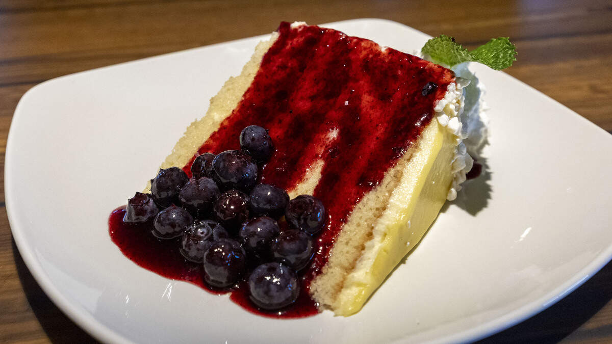 Firebirds Wood Fired Grill’s Five-Layer Lemon Cake is topped with a fresh blueberry sauce ($10.25).