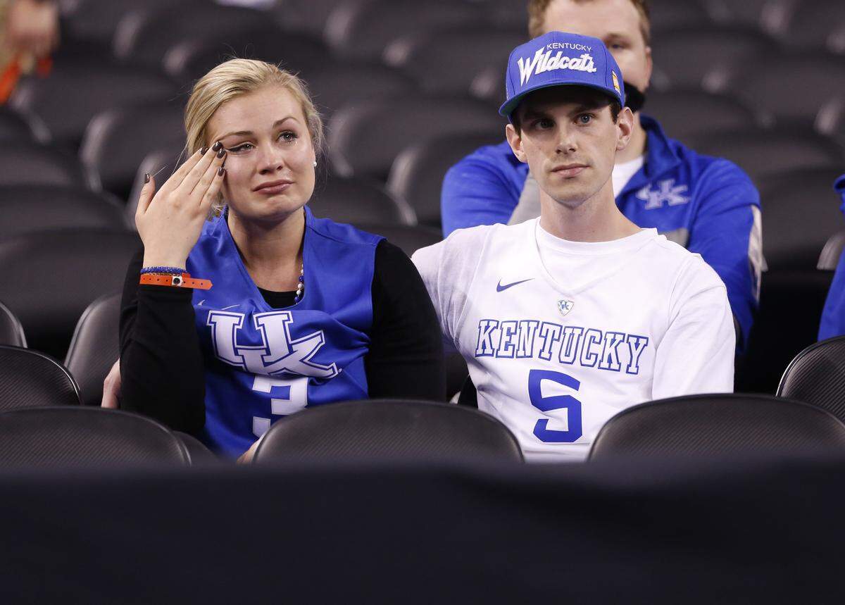 Kentucky fans wept in their seats after Wisconsin upset the previously unbeaten Wildcats 71-64 in the 2015 NCAA Tournament Final Four at Lucas Oil Stadium in Indianapolis.