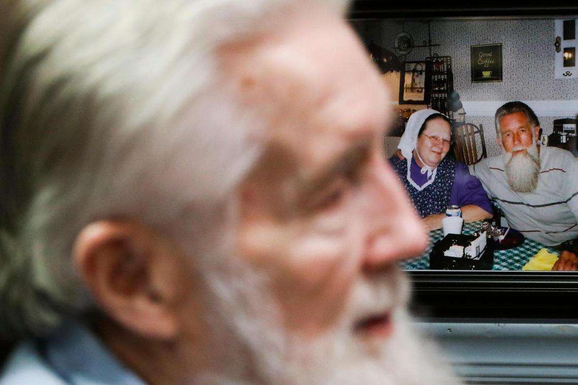 Dozens of pictures of Jerry and the late Sandy Tucker sit on walls in Jerry’s private residence at the Galilean Home in Liberty, Ky., Monday, Dec. 20, 2021. Jerry and Sandy first met at an A&W Root Beer Stand in Detroit and were married on Jan. 21, 1963, just three months after they met.