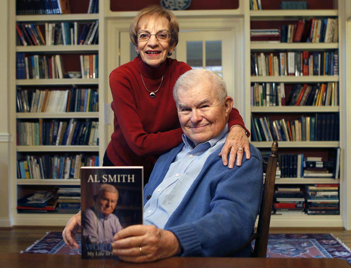 Al Smith and his wife Martha Helen Smith pose at their Lexington home with his memoir, “Wordsmith: My Life in Journalism” on Nov. 4, 2011.
