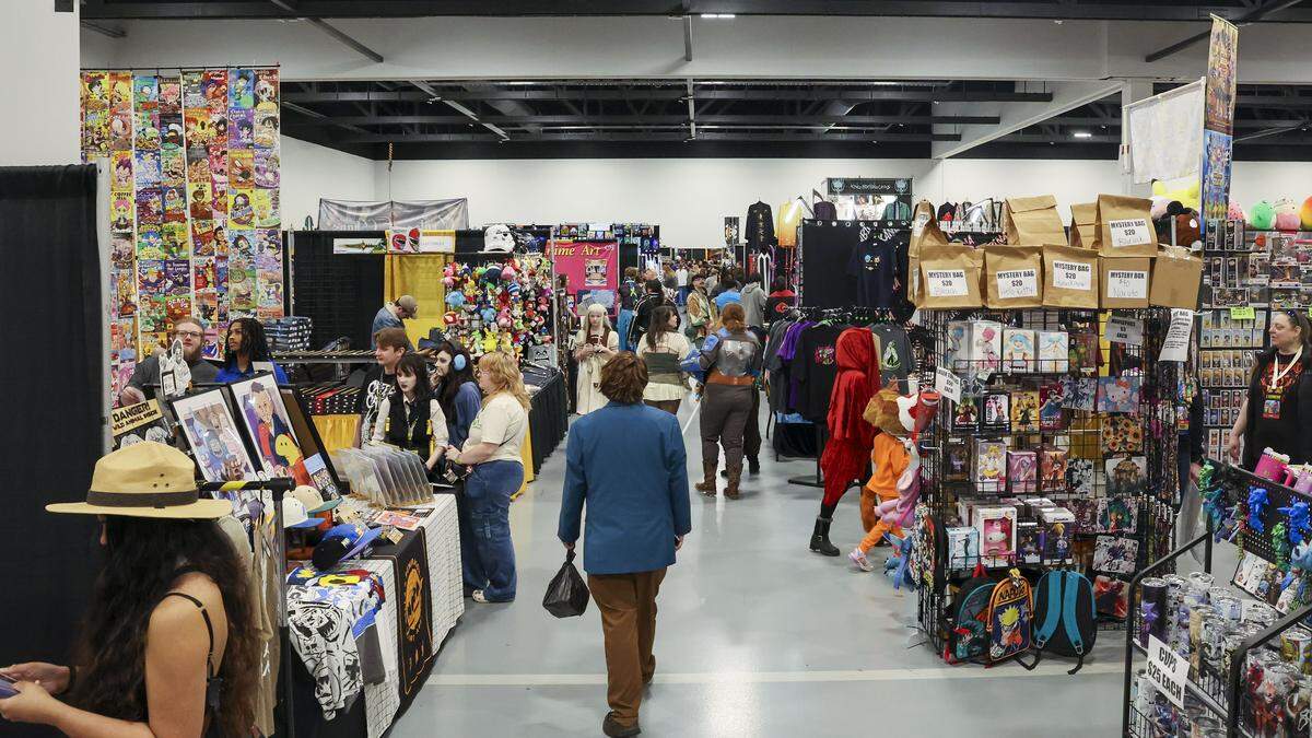 Patrons shop at vendors on the exhibit floor during the 2025 Lexington Comic and Toy Convention at the Central Bank Center in Lexington, Ky. on Sunday, March 9, 2025. Vendors sell rare toys and collectibles, comics, vintage video games, art work and pop culture goods from their booths. 
