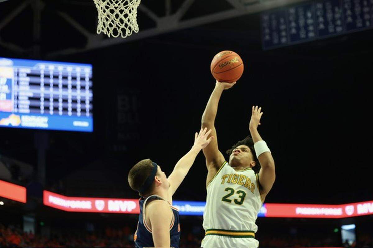 St. Xavier’s Jeremiah Jackson shoots over Grayson County’s Brody Armstrong during the Tigers’ 67-37 win in the UK HealthCare Boys’ Basketball Sweet 16 state tournament semifinals at Rupp Arena on Saturday.