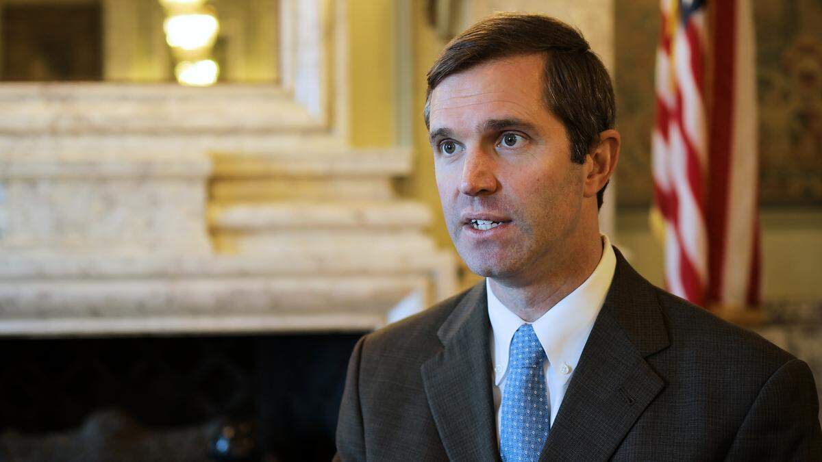 Gov.-elect Andy Beshear speaks with a reporter in the Kentucky Capitol on Dec. 5, 2019.