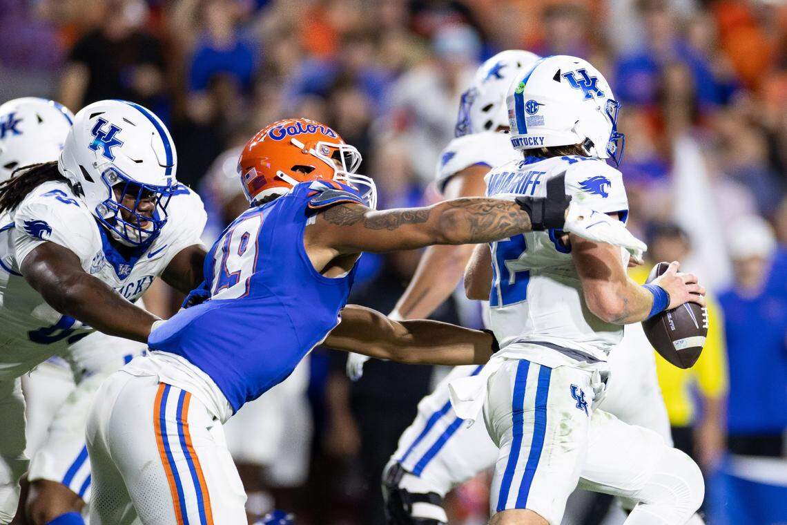 Oct 19, 2024; Gainesville, Florida, USA; Florida Gators defensive end T.J. Searcy (19) attempts to tackle Kentucky Wildcats quarterback Brock Vandagriff (12) during the second half at Ben Hill Griffin Stadium. Mandatory Credit: Matt Pendleton-Imagn Images