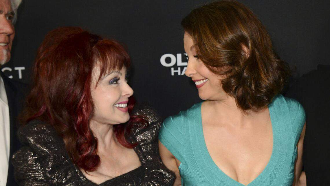 FILE - Ashley Judd, right, and her mother, Naomi Judd, arrive at the LA premiere of “Olympus Has Fallen,” at the ArcLight Theatre, Monday, March 18, 2013, in Los Angeles.