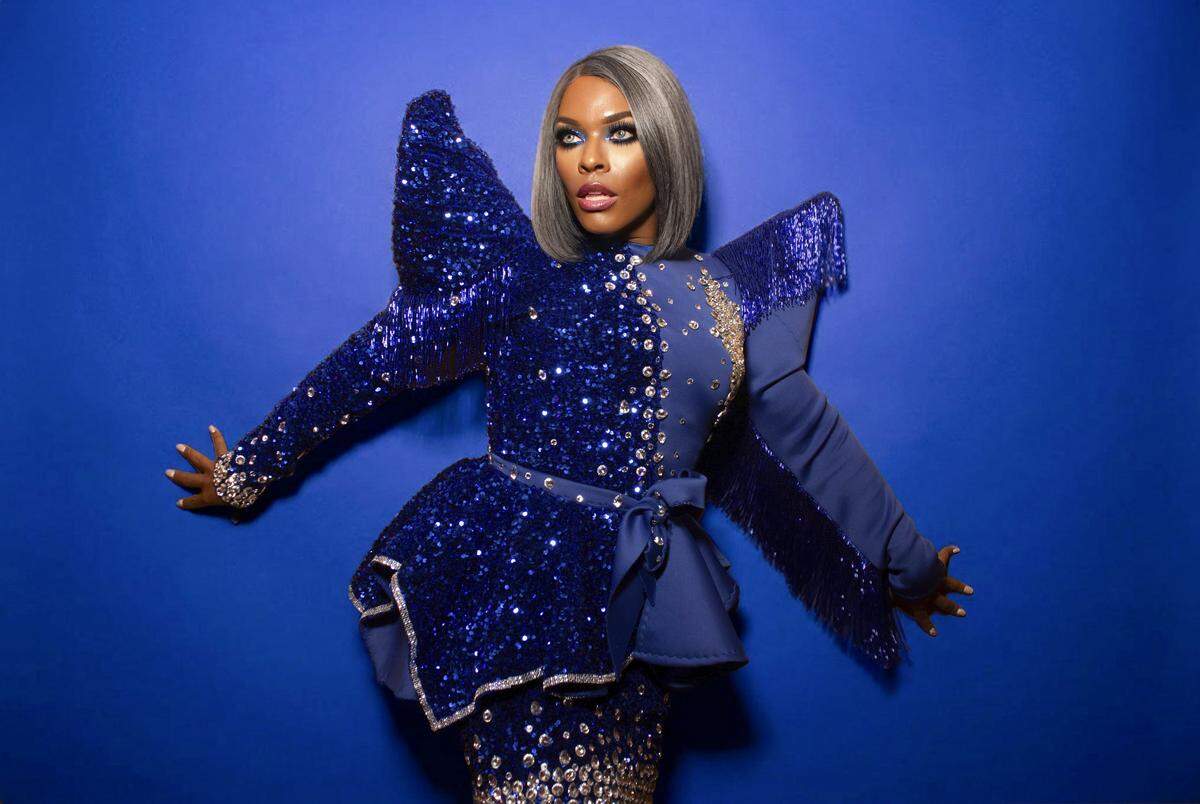 Mystique Summers, competitor on “RuPaul’s Drag Race” Season 2, poses in a structured blue bedazzled top.