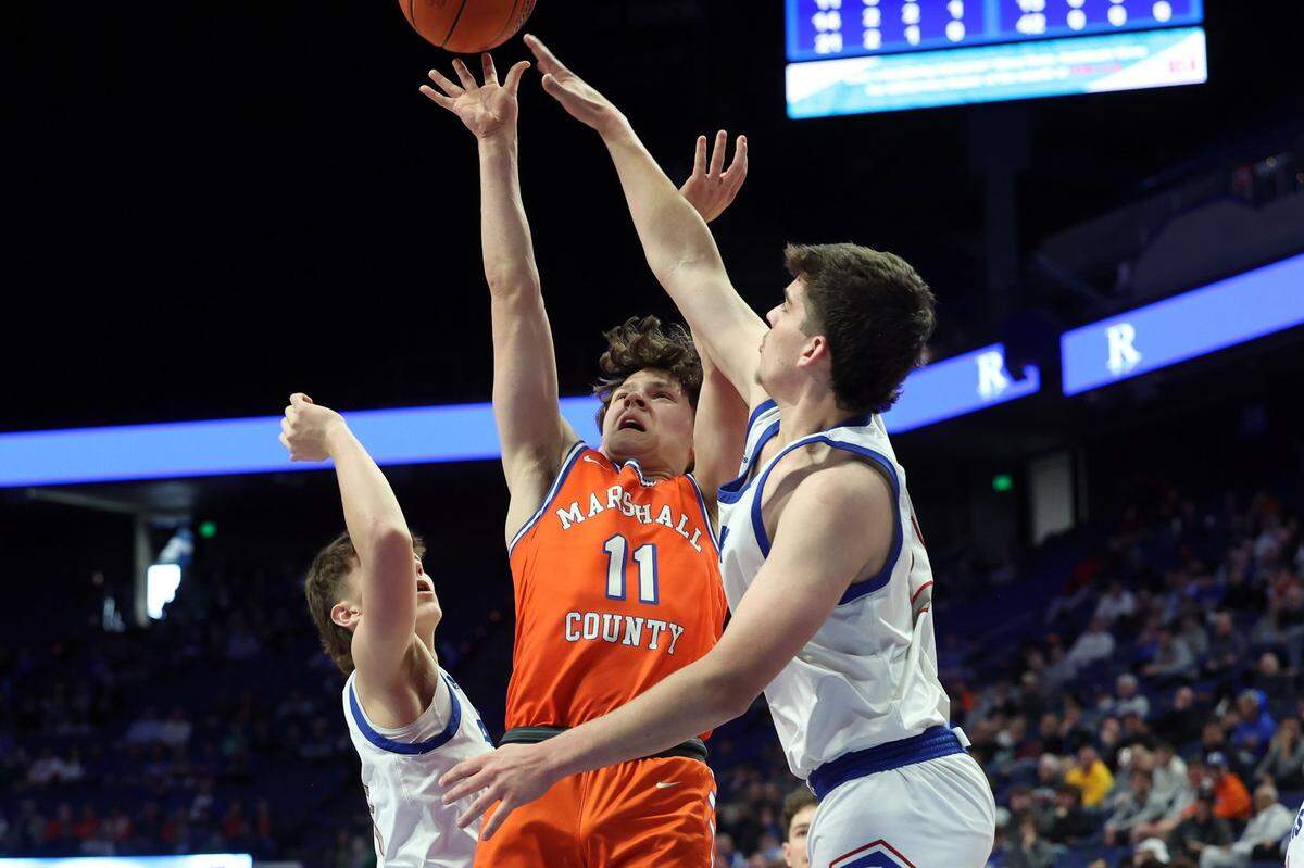Alex Staples (11) led Marshall County with 13 points but nothing came easy for the Marshals against Adair County.