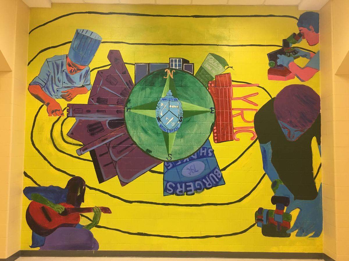 This mural was removed from the exterior of Bryan Station High School and duplicated inside.