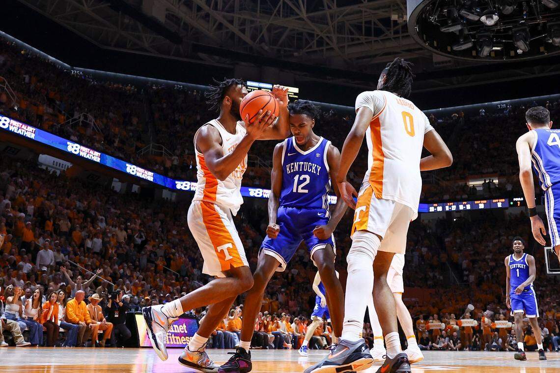 Kentucky guard Antonio Reeves (12) celebrates scoring against Tennessee during Saturday’s game at Thompson-Boling Arena in Knoxville. Reeves finished with 27 points.