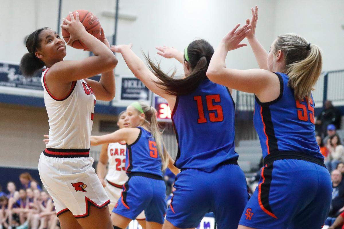 Ciara Byars (3) shoots over Southwestern’s Makayla Noritis (15) and Payton Acey (55) during a matchup of Sweet 16 teams earlier this season. Clark County won 62-61.